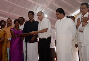 PM hands over title deeds for plantation community