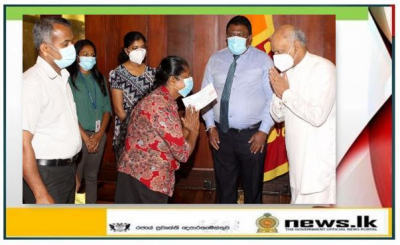 Handing over the cheque of Compensation to the Next of Kin of late Mr. K P Manjula Antony