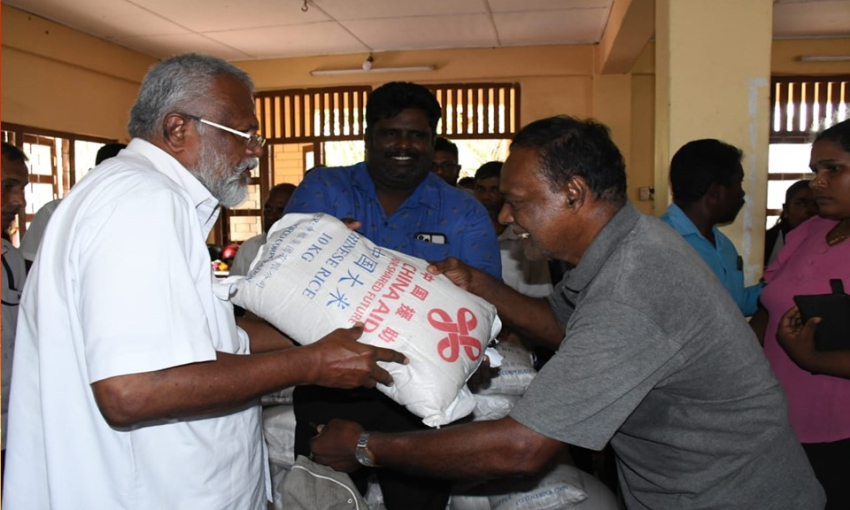 Minister Douglas Devananda distributes rice donated by China to 16000 Fishing families in Jaffna