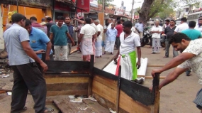 Communities come together to repair burnt  Muslim shop